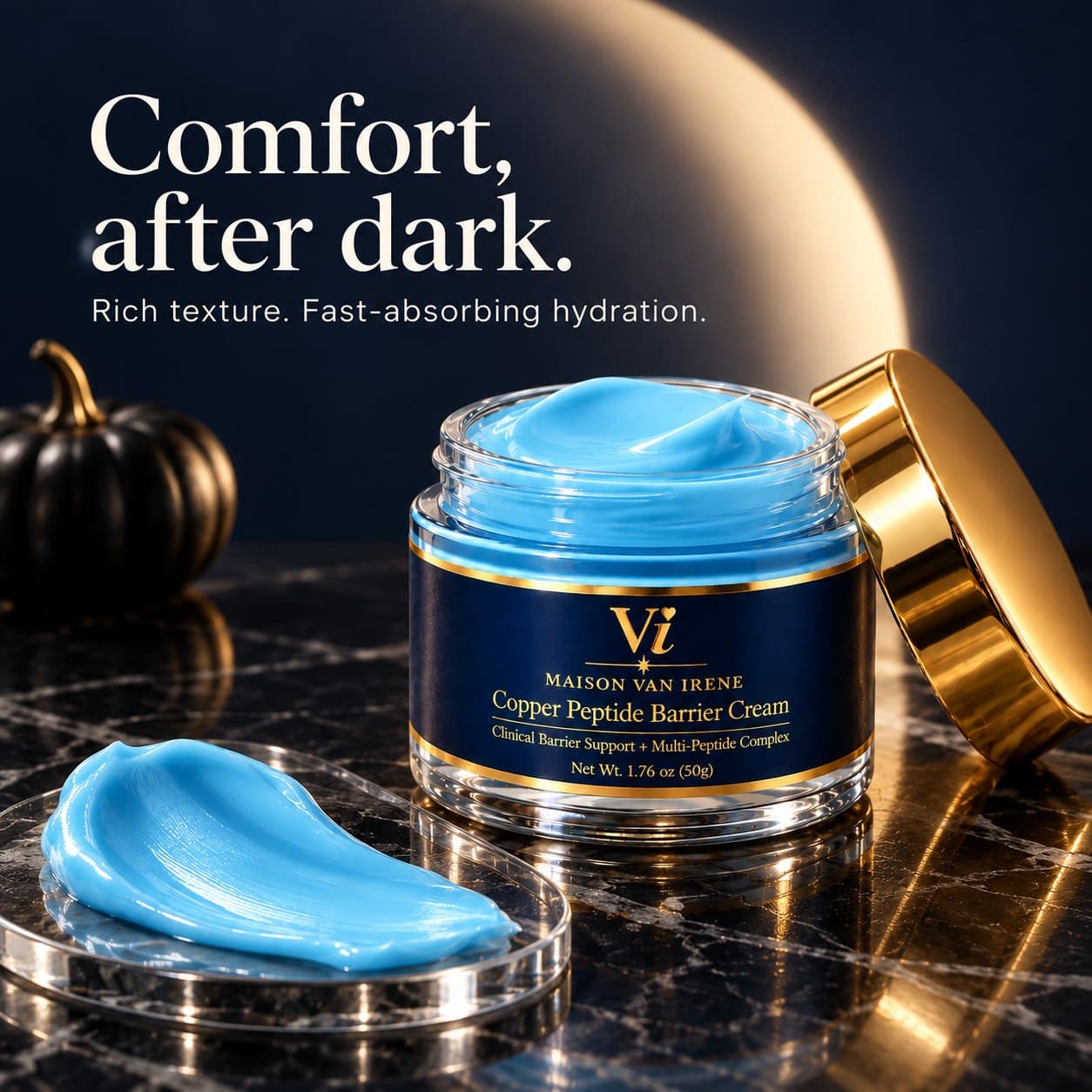 Comfort, after dark — open Copper Peptide Barrier Cream jar with a swatch of the rich blue cream on dark marble